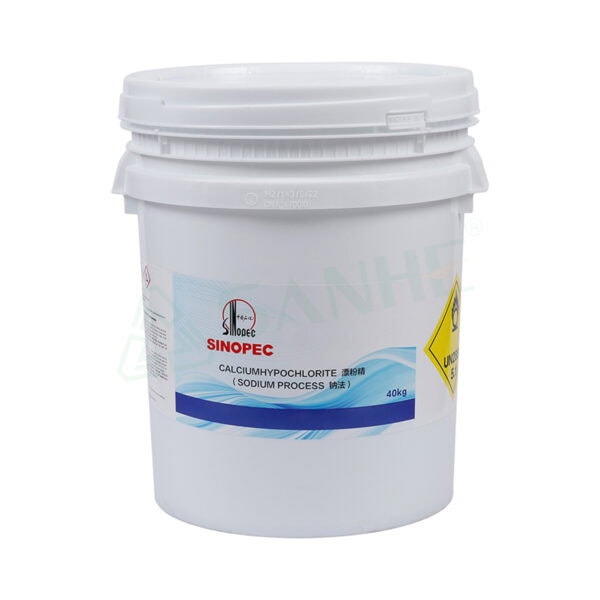 Large white bucket of Sinopec calcium hypochlorite, used for disinfection and water treatment, with safety warning labels.